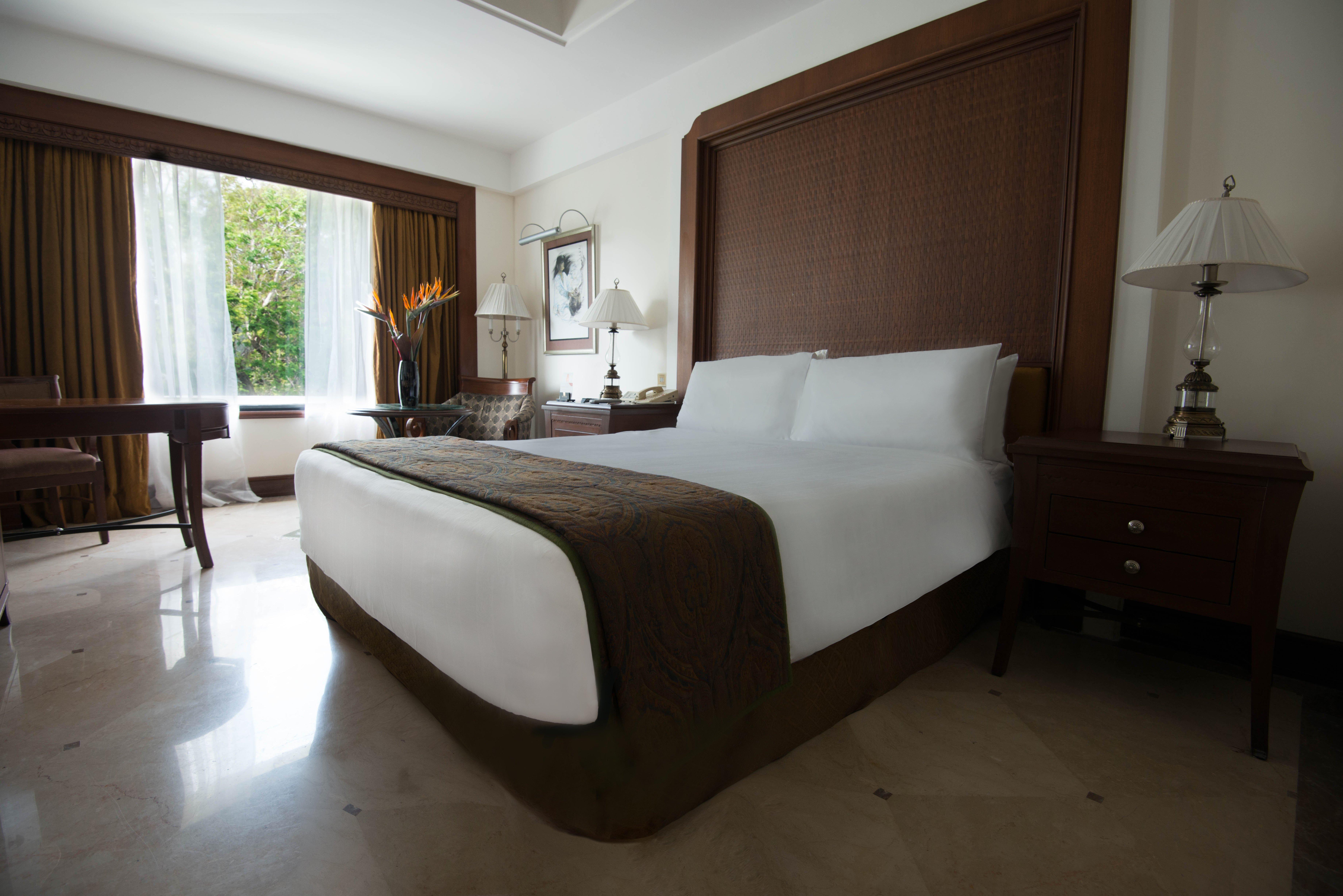 فندق كراون بلازا شيناي أديار بارك المظهر الخارجي الصورة A bedroom at the Taj Bengal